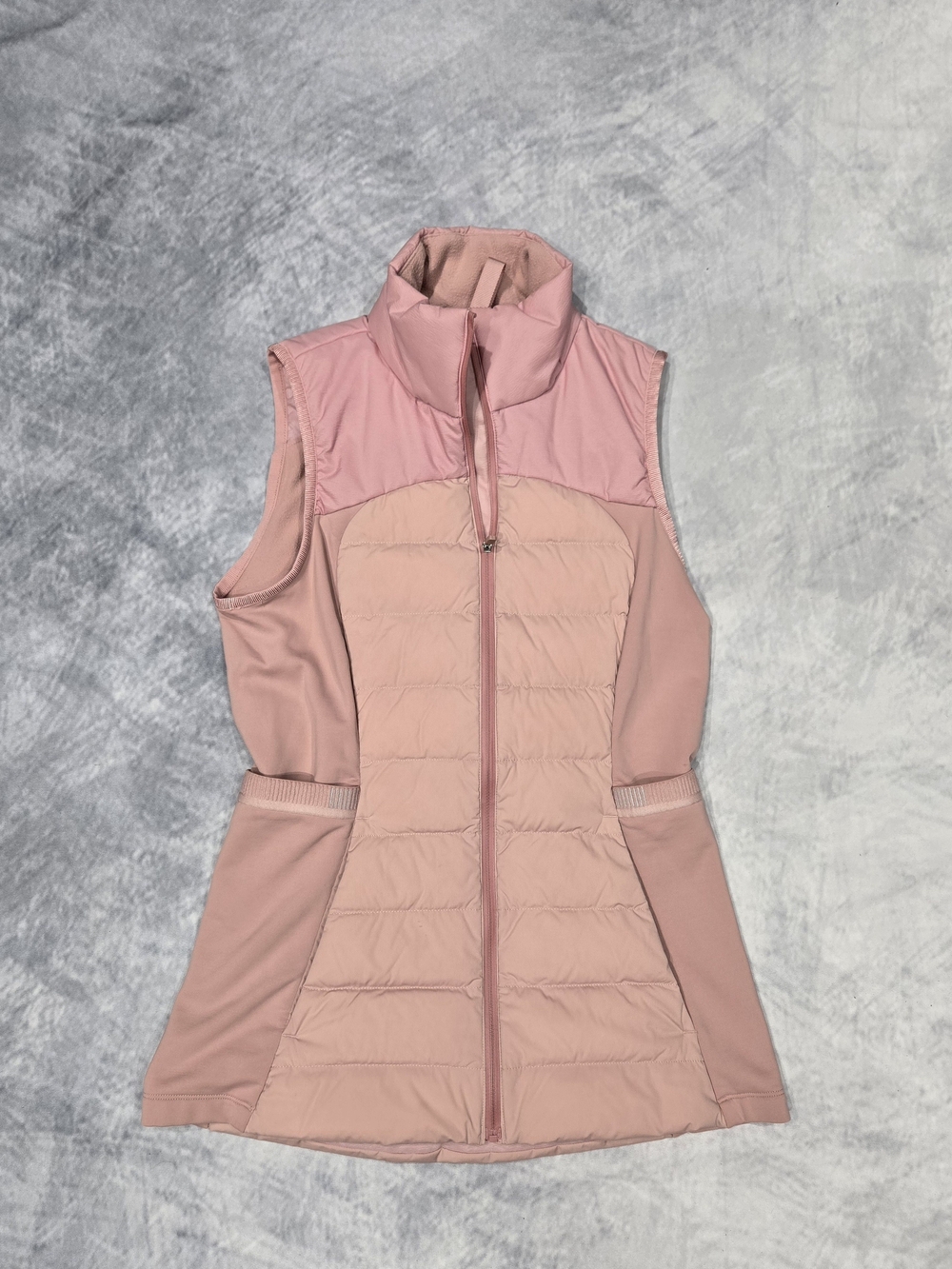 Lululemon Down for It All Vest featuring a quilted core and stretchy side panels